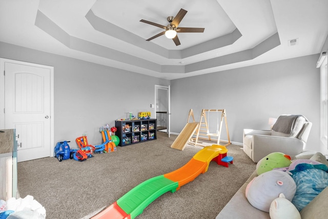 1044 Thrasher Dr, Clarksville, TN 37040 - rec room with visible vents, a tray ceiling, carpet, baseboards, and ceiling fan