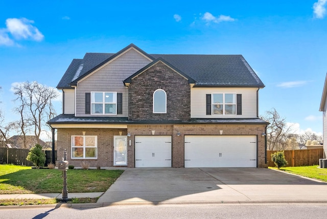 1044 Thrasher Dr, Clarksville, TN 37040 - view of front of house with a front lawn, driveway, fence, a garage, and brick siding