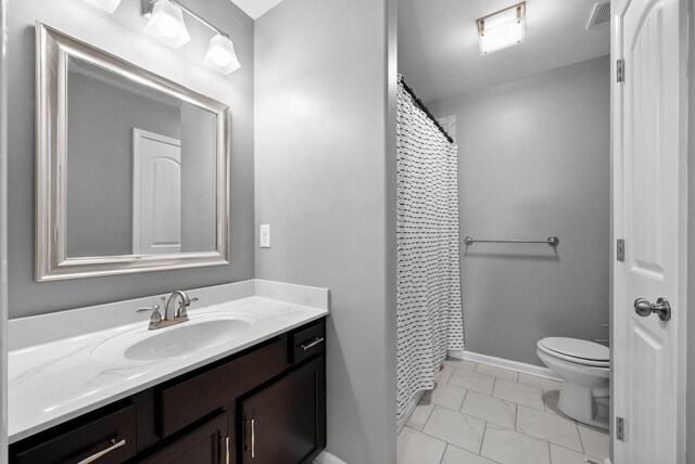 1044 Thrasher Dr, Clarksville, TN 37040 - full bathroom with visible vents, toilet, vanity, and baseboards