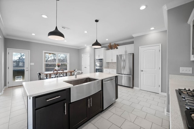 1044 Thrasher Dr, Clarksville, TN 37040 - kitchen featuring visible vents, a sink, stainless steel appliances, white cabinetry, and tasteful backsplash