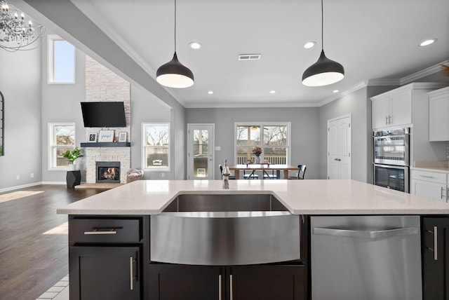1044 Thrasher Dr, Clarksville, TN 37040 - kitchen featuring a healthy amount of sunlight, visible vents, a sink, stainless steel appliances, and open floor plan