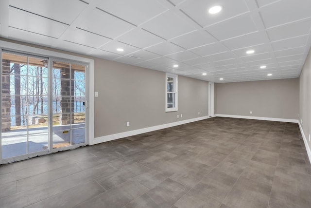 unfurnished room featuring recessed lighting and baseboards