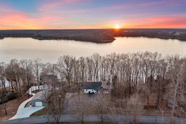 aerial view at dusk with a water view