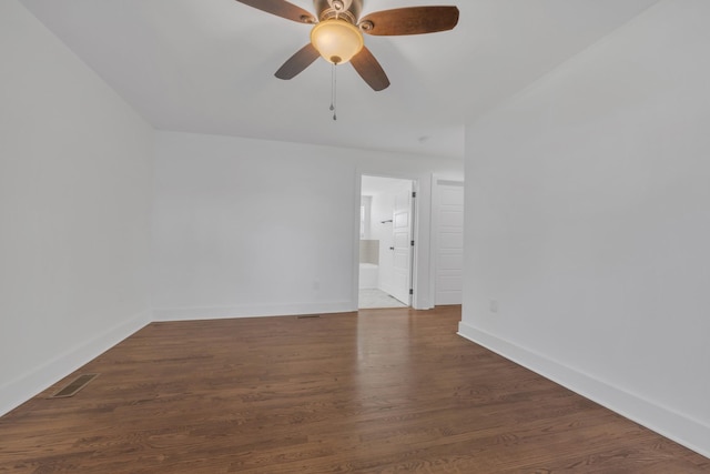 unfurnished room featuring visible vents, baseboards, a ceiling fan, and wood finished floors
