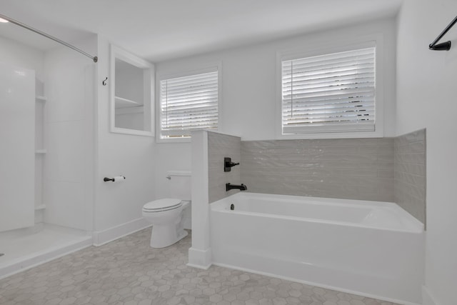 full bathroom with a garden tub, toilet, walk in shower, and a healthy amount of sunlight