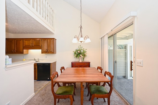dining room with a chandelier, light colored carpet, and lofted ceiling
