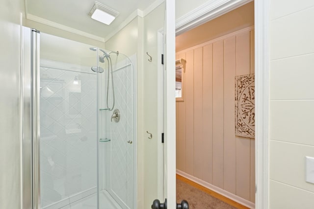 bathroom with visible vents, a stall shower, and crown molding