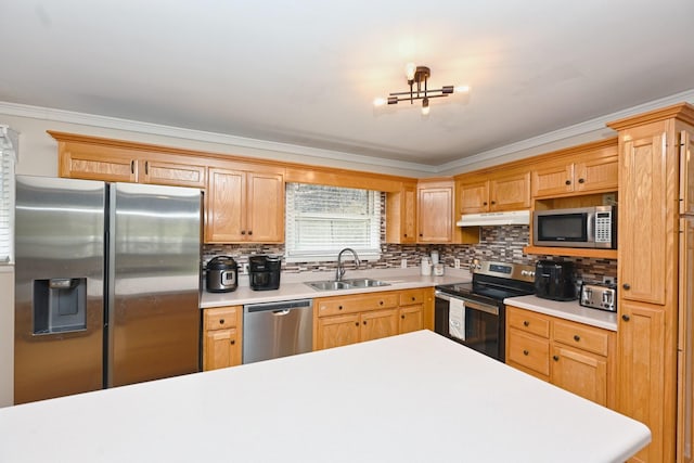 kitchen featuring a sink, light countertops, under cabinet range hood, and stainless steel appliances