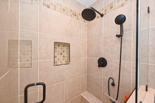 bathroom with a shower stall