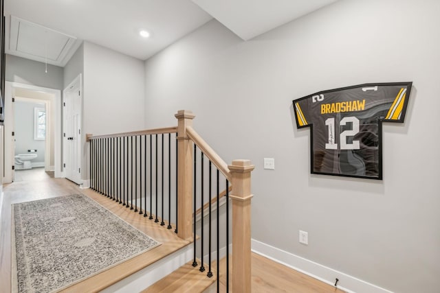staircase with baseboards, wood finished floors, recessed lighting, and attic access