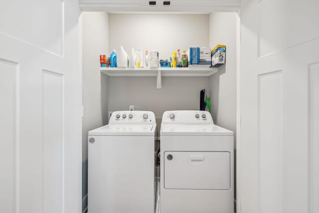 laundry room featuring independent washer and dryer and laundry area