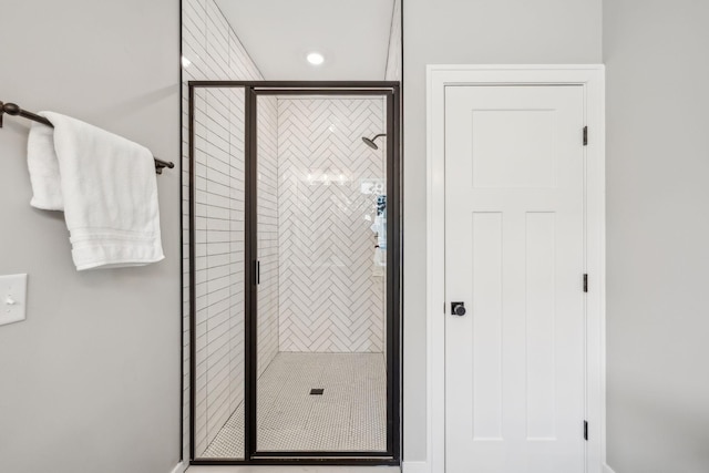 full bath with recessed lighting and a shower stall