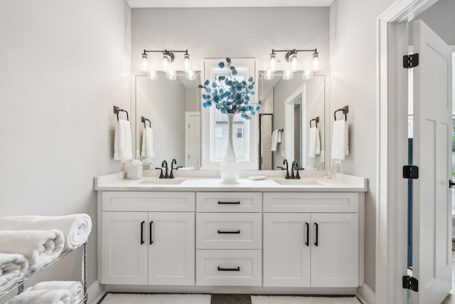 full bath with double vanity and a sink