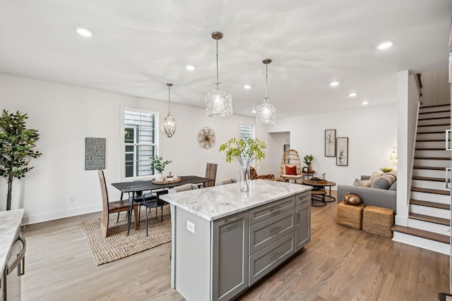 kitchen with gray cabinets, light wood-style flooring, and recessed lighting