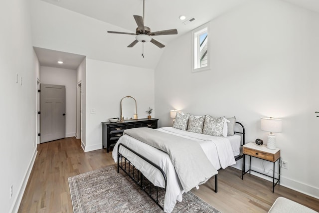 bedroom with light wood finished floors, baseboards, and visible vents