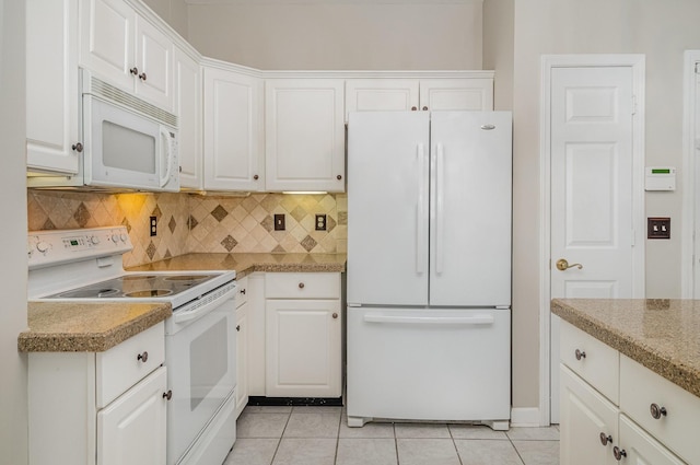 kitchen featuring light tile patterned floors, decorative backsplash, white cabinets, and white appliances