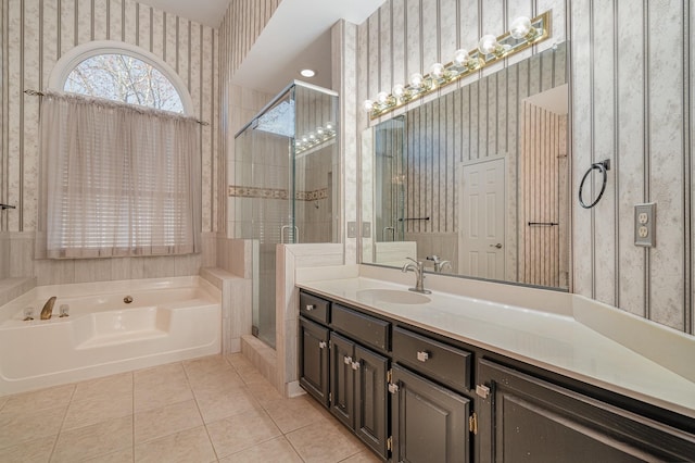 bathroom with wallpapered walls, a shower stall, a garden tub, and tile patterned floors