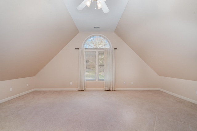 bonus room with baseboards, lofted ceiling, a ceiling fan, and carpet floors