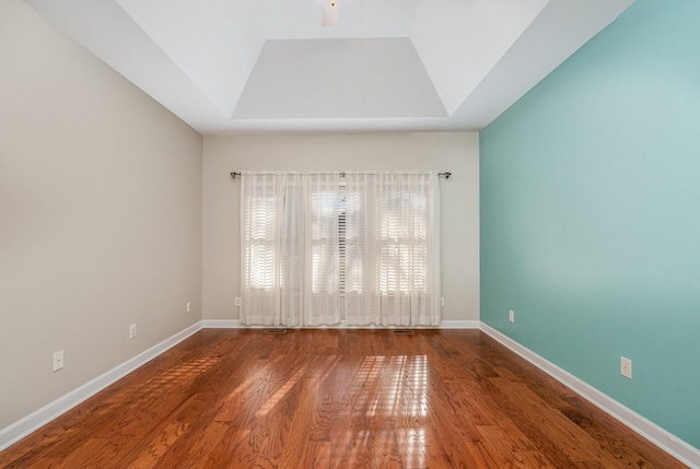 empty room with wood finished floors and baseboards