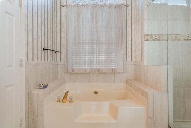 full bathroom with a bath
