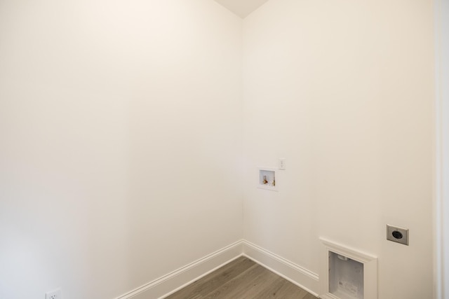 158 Oasis Dr, La Vergne, TN 37086 - clothes washing area with wood finished floors, baseboards, hookup for an electric dryer, hookup for a washing machine, and laundry area