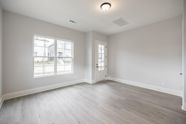 158 Oasis Dr, La Vergne, TN 37086 - unfurnished room featuring visible vents, baseboards, and wood finished floors