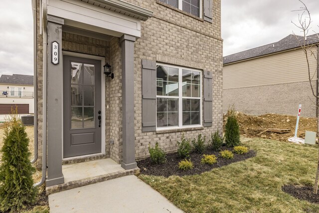 158 Oasis Dr, La Vergne, TN 37086 - doorway to property with a yard and brick siding