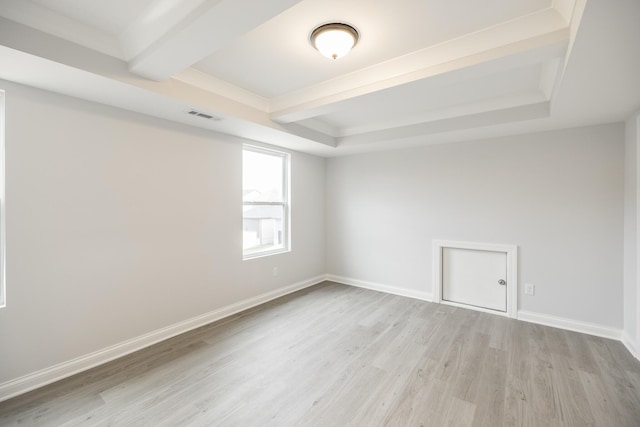 158 Oasis Dr, La Vergne, TN 37086 - empty room featuring baseboards, visible vents, a tray ceiling, beamed ceiling, and light wood-type flooring