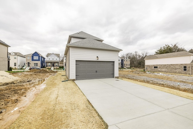 158 Oasis Dr, La Vergne, TN 37086 - garage featuring a residential view and driveway