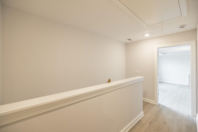 158 Oasis Dr, La Vergne, TN 37086 - hallway featuring visible vents, an upstairs landing, light wood finished floors, baseboards, and attic access