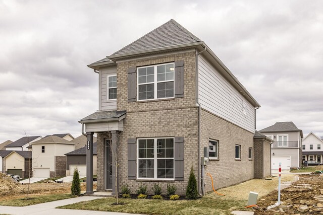 158 Oasis Dr, La Vergne, TN 37086 - view of front facade with brick siding and roof with shingles