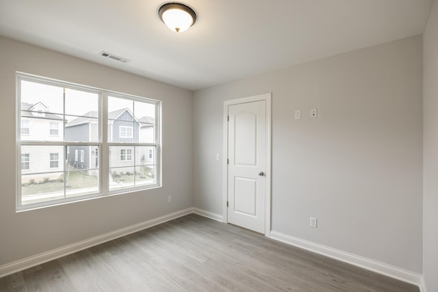 158 Oasis Dr, La Vergne, TN 37086 - spare room with a wealth of natural light, visible vents, baseboards, and wood finished floors