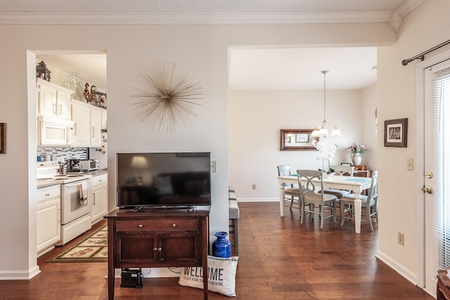 903 Churchill Xing, Madison, TN 37115 - interior space featuring baseboards, dark wood-type flooring, an inviting chandelier, and ornamental molding