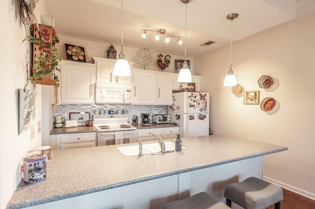 903 Churchill Xing, Madison, TN 37115 - kitchen with decorative light fixtures, white appliances, tasteful backsplash, and a breakfast bar