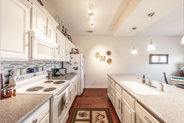 903 Churchill Xing, Madison, TN 37115 - kitchen featuring white appliances, visible vents, a sink, dark wood-type flooring, and backsplash