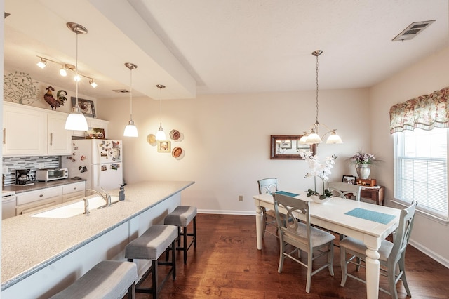 903 Churchill Xing, Madison, TN 37115 - dining area featuring visible vents, baseboards, and dark wood-type flooring