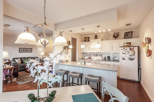903 Churchill Xing, Madison, TN 37115 - dining area with an inviting chandelier, visible vents, dark wood-type flooring, and baseboards