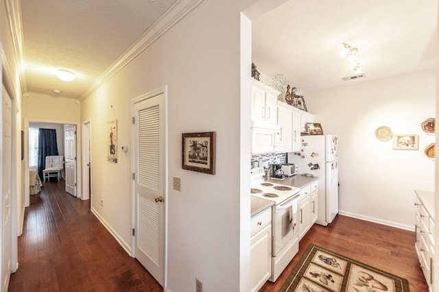 903 Churchill Xing, Madison, TN 37115 - kitchen featuring white appliances, dark wood-type flooring, white cabinets, crown molding, and tasteful backsplash