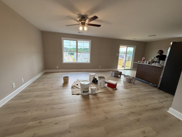205 Cardinal Crk, Clarksville, TN 37040 - living room featuring a ceiling fan, baseboards, and light wood-style floors