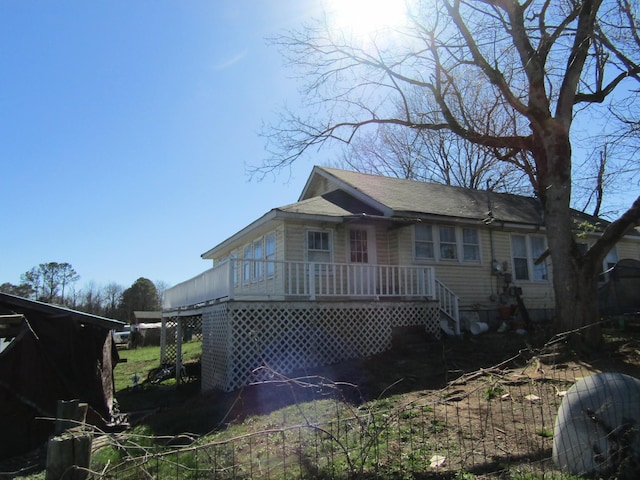 view of front facade featuring roof with shingles