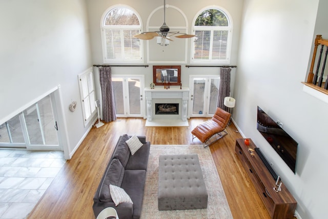 5217 Apple Mill Ct, Brentwood, TN 37027 - living area with a high ceiling, ceiling fan, healthy amount of natural light, and a fireplace