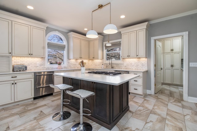 5217 Apple Mill Ct, Brentwood, TN 37027 - kitchen with light countertops, appliances with stainless steel finishes, decorative backsplash, a center island, and pendant lighting