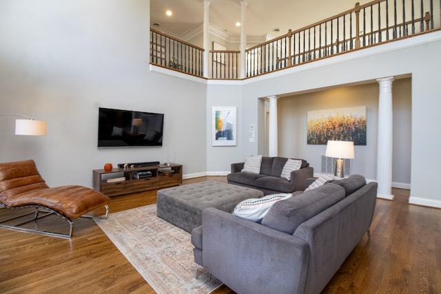5217 Apple Mill Ct, Brentwood, TN 37027 - living room featuring ornate columns, a high ceiling, baseboards, wood finished floors, and recessed lighting