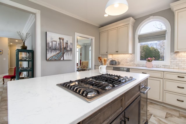 5217 Apple Mill Ct, Brentwood, TN 37027 - kitchen featuring stainless steel gas cooktop, ornamental molding, tasteful backsplash, light marble finish floors, and cream cabinetry
