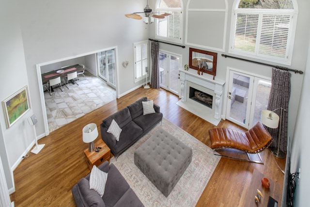 5217 Apple Mill Ct, Brentwood, TN 37027 - living area with a towering ceiling, ceiling fan, a premium fireplace, wood finished floors, and baseboards