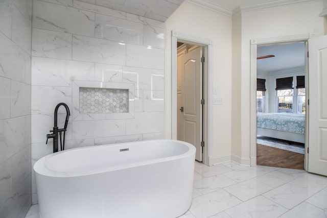 5217 Apple Mill Ct, Brentwood, TN 37027 - ensuite bathroom with crown molding, a freestanding tub, marble finish floors, and baseboards