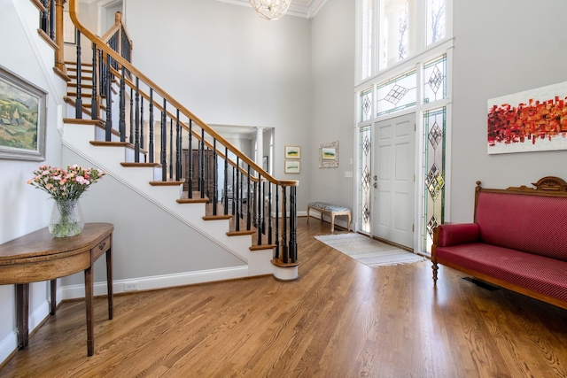 5217 Apple Mill Ct, Brentwood, TN 37027 - foyer featuring a towering ceiling, stairway, wood finished floors, baseboards, and ornamental molding