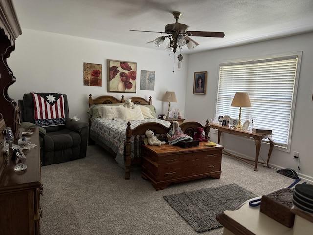bedroom featuring baseboards, a ceiling fan, and carpet floors