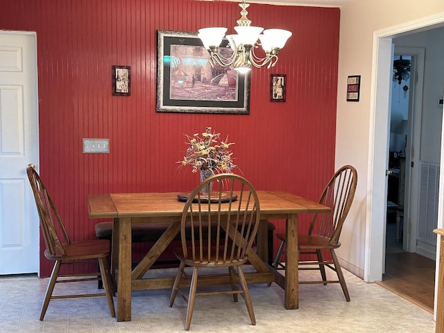 dining room with a chandelier