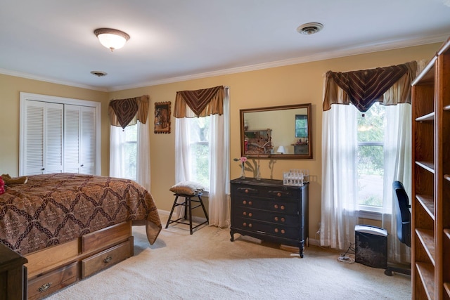 carpeted bedroom with visible vents, baseboards, and ornamental molding